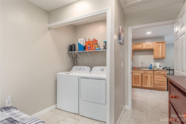 laundry area with light tile floors and washing machine and clothes dryer