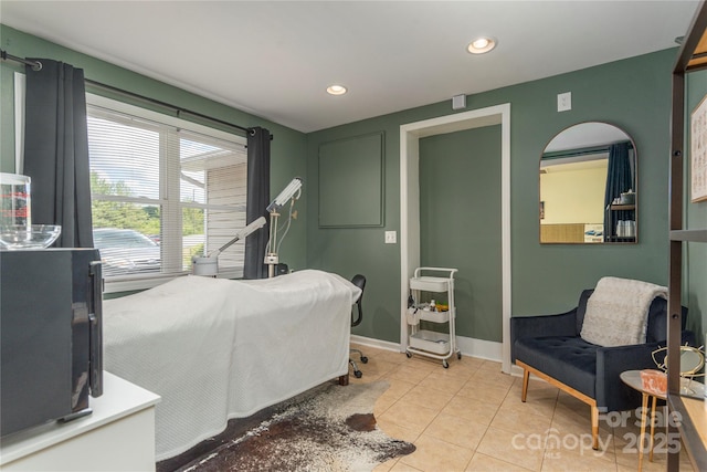 bedroom featuring baseboards, recessed lighting, and light tile patterned floors