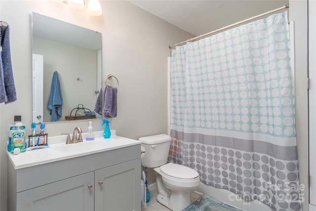 full bath featuring toilet, tile patterned floors, vanity, and curtained shower