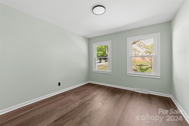 spare room featuring hardwood / wood-style flooring