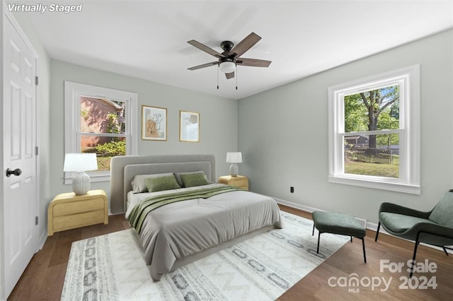 bedroom with ceiling fan and hardwood / wood-style floors