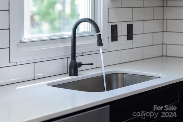 room details with decorative backsplash and sink