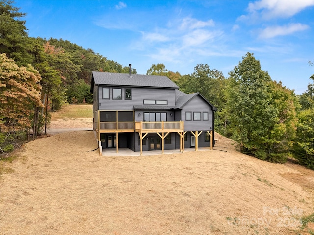 back of property with a patio area and a deck