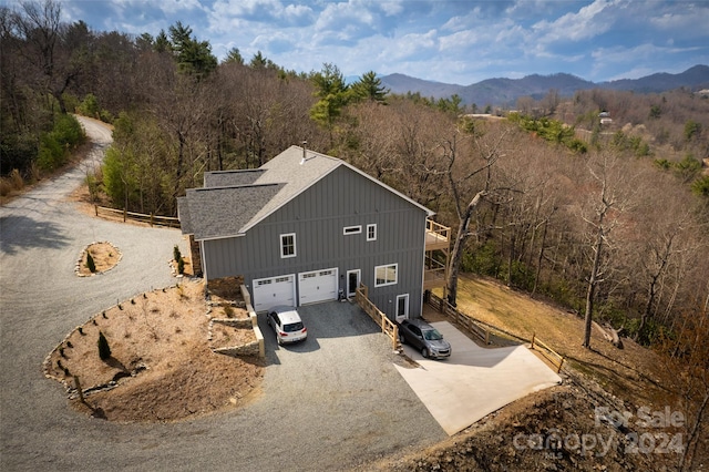 birds eye view of property with a mountain view