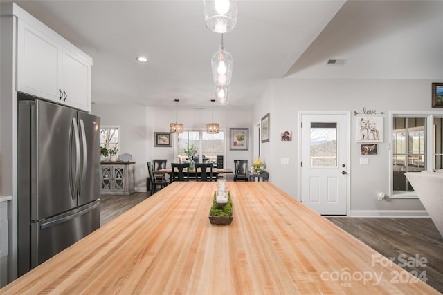 dining space featuring an inviting chandelier and dark hardwood / wood-style floors