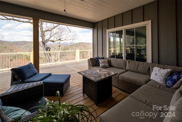 wooden deck with an outdoor hangout area