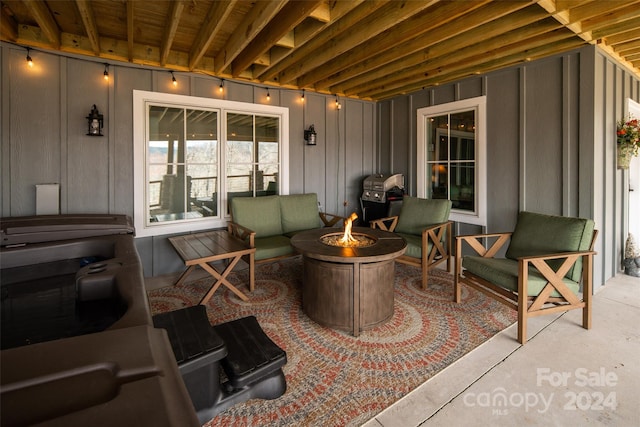 view of patio featuring area for grilling and an outdoor living space with a fire pit