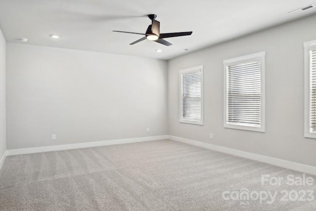 carpeted empty room with ceiling fan