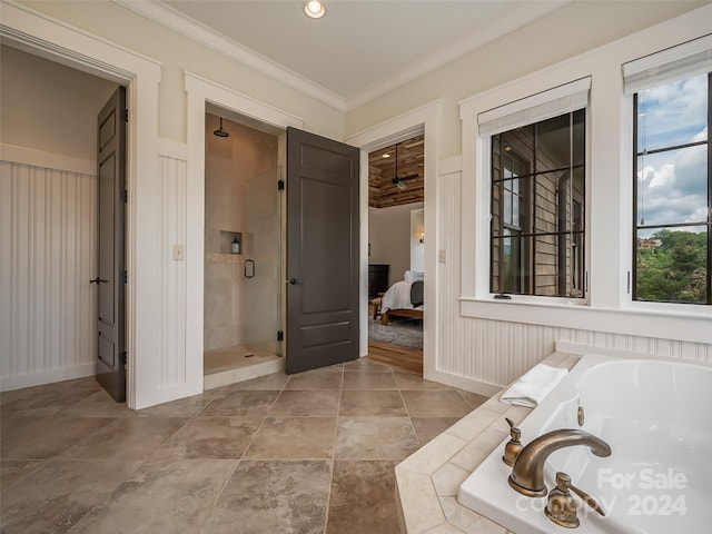 bathroom featuring independent shower and bath, tile flooring, and crown molding