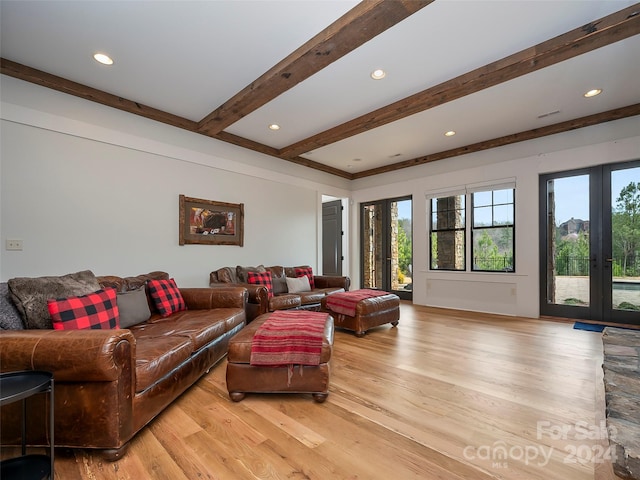 living room with light hardwood / wood-style flooring, french doors, and beamed ceiling