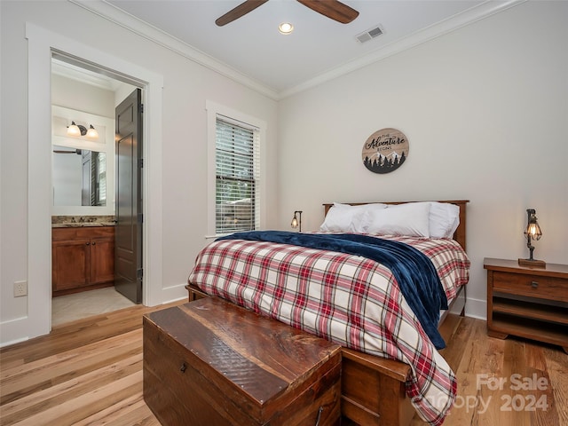 bedroom featuring connected bathroom, ceiling fan, light hardwood / wood-style flooring, crown molding, and sink