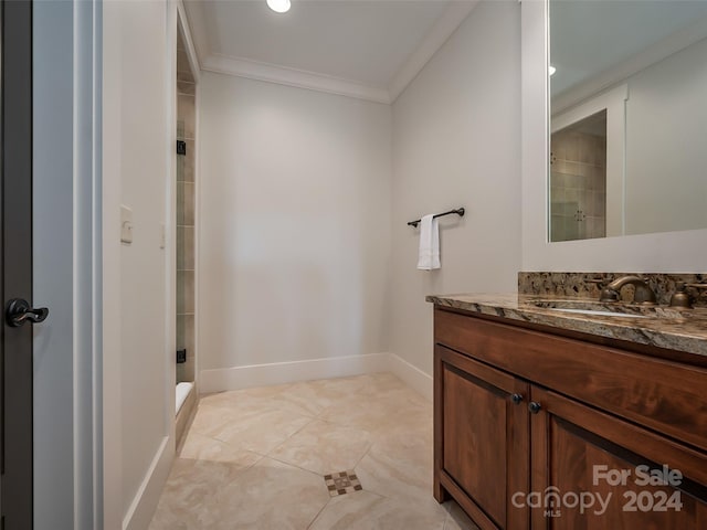 bathroom featuring vanity, tile floors, and crown molding