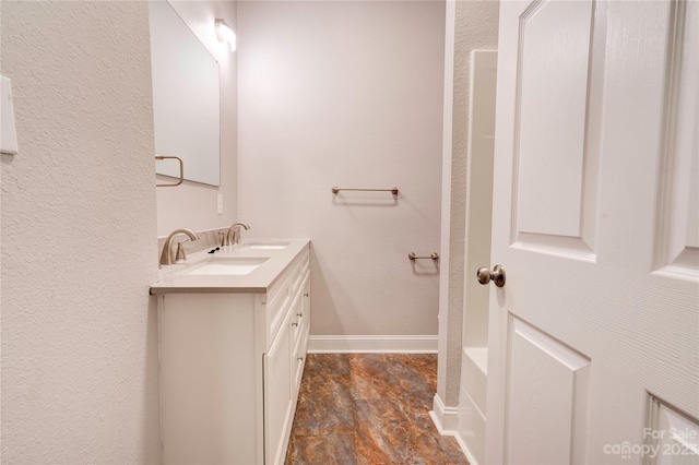 bathroom with tile floors and vanity