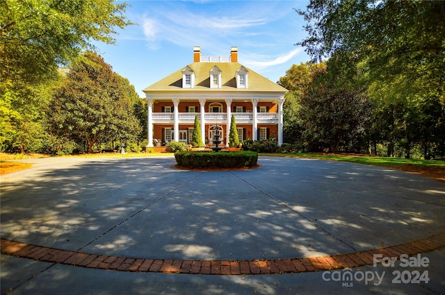 view of front of home with a balcony