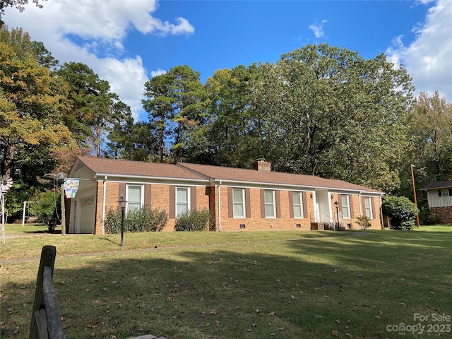 ranch-style house with a front lawn and a garage