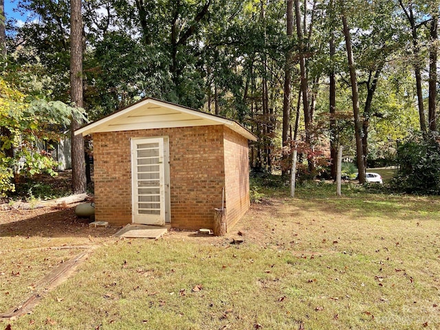 view of outdoor structure with a lawn