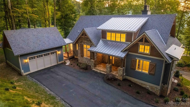 craftsman-style house with covered porch and a garage