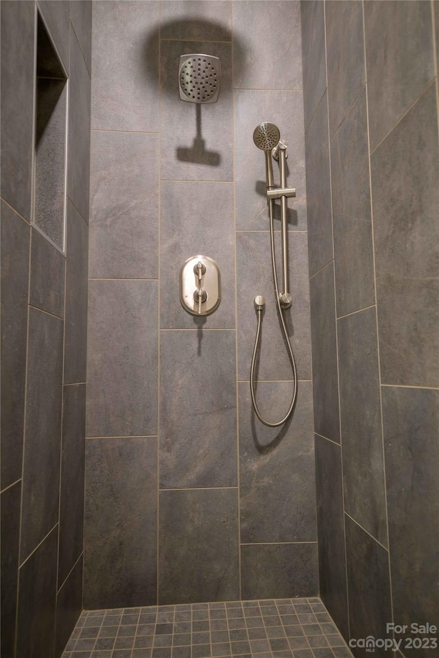 bathroom with tiled shower