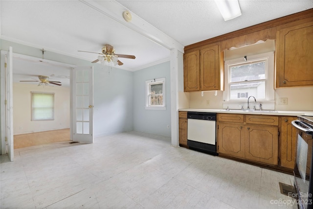 kitchen featuring light tile flooring, white dishwasher, ceiling fan, and sink