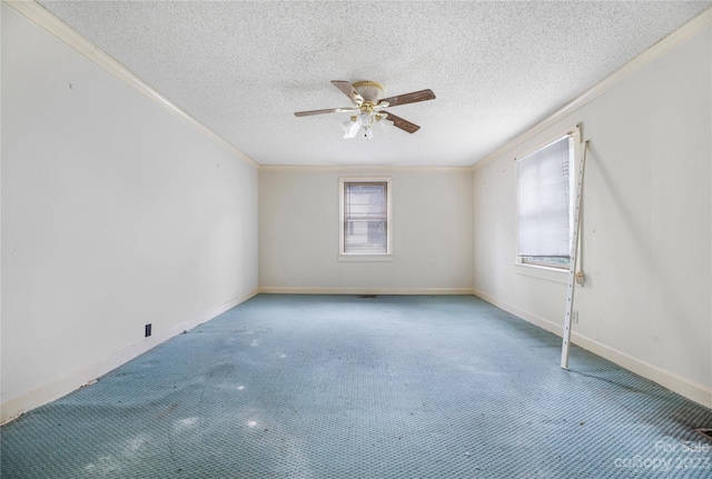 spare room featuring ceiling fan, light carpet, ornamental molding, and a textured ceiling