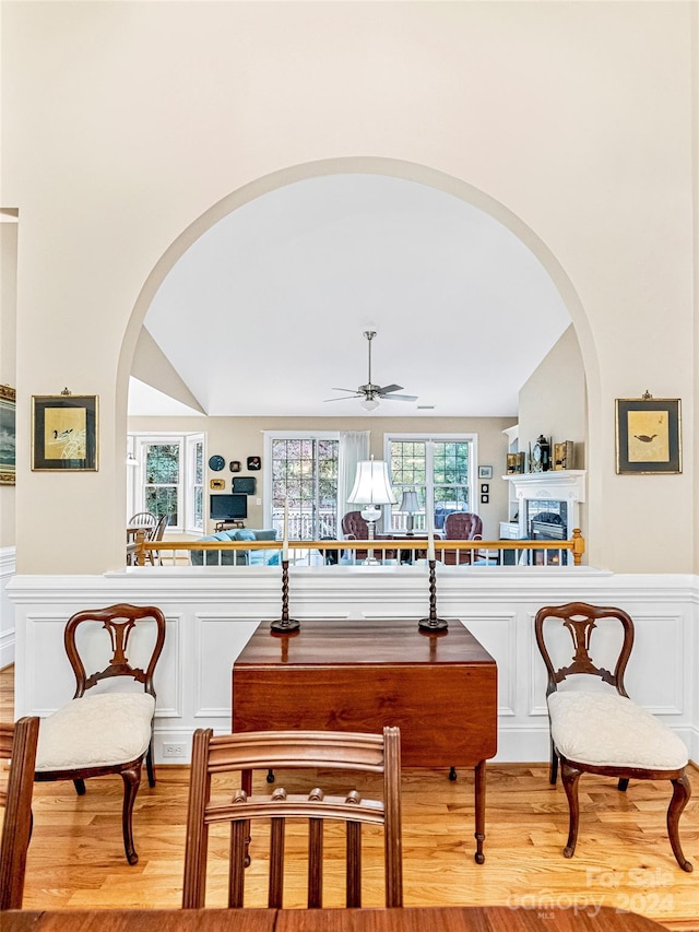interior space with light hardwood / wood-style flooring, ceiling fan, and lofted ceiling