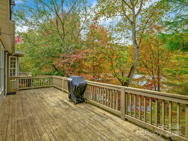 wooden terrace with area for grilling