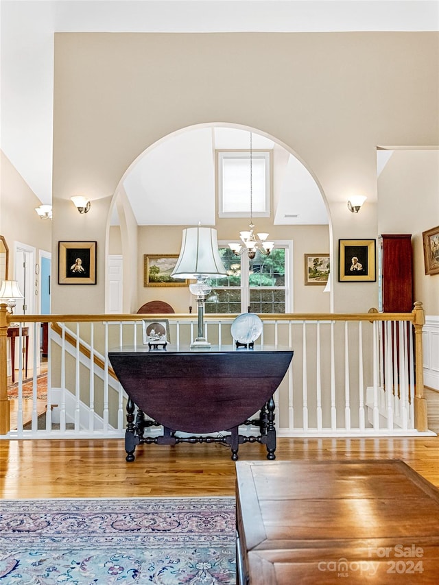 interior space featuring a chandelier and wood-type flooring