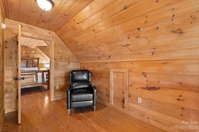 unfurnished room with dark hardwood / wood-style flooring, wooden ceiling, wood walls, and vaulted ceiling