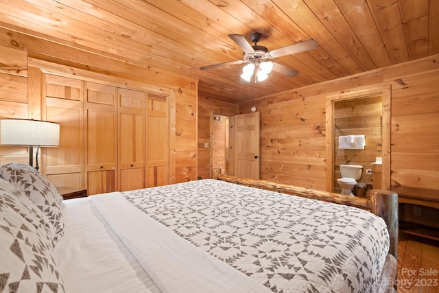 bedroom with wood walls, wood ceiling, a closet, and ceiling fan