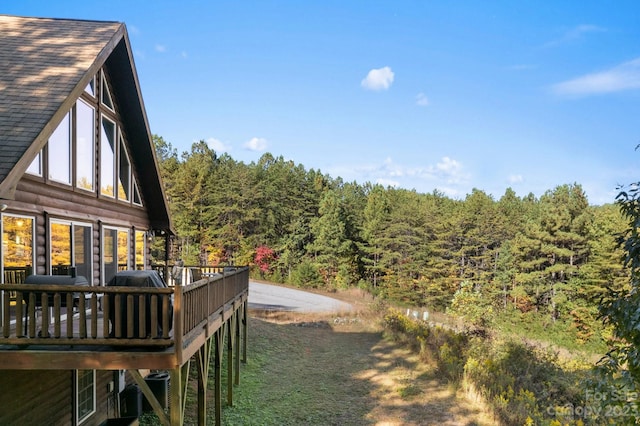 view of yard featuring a wooden deck