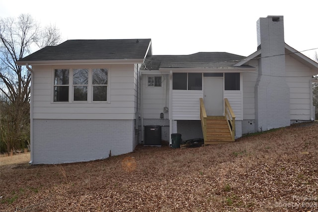 back of property featuring cooling unit