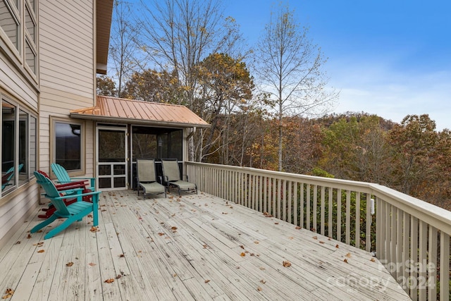 deck with a sunroom