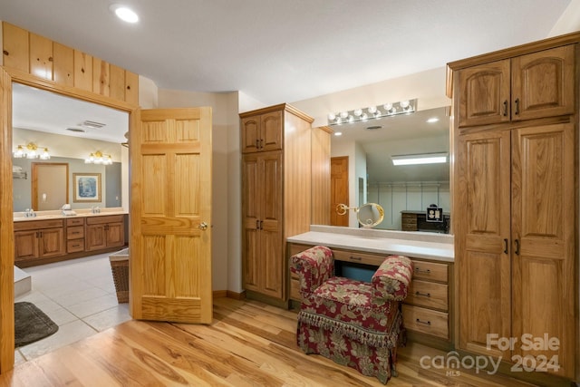 bathroom featuring vanity and hardwood / wood-style floors