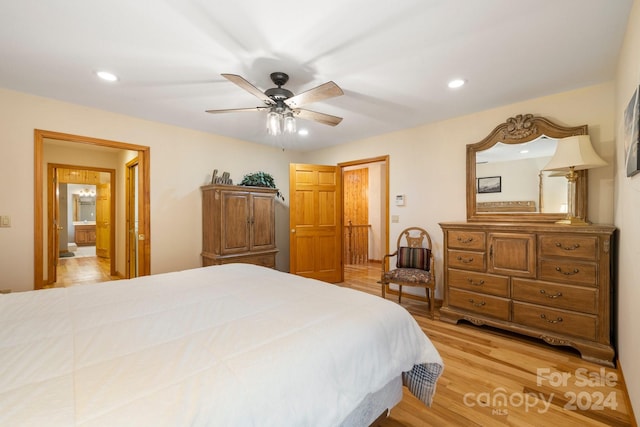 bedroom with ceiling fan and light hardwood / wood-style floors