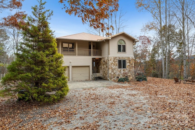 view of front of house featuring a balcony and a garage