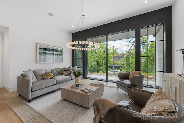 living room featuring a wealth of natural light and light hardwood / wood-style floors