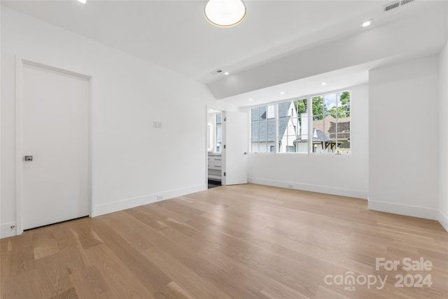 spare room with light hardwood / wood-style floors