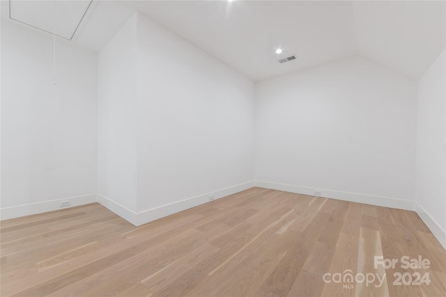 bonus room featuring light hardwood / wood-style flooring and lofted ceiling