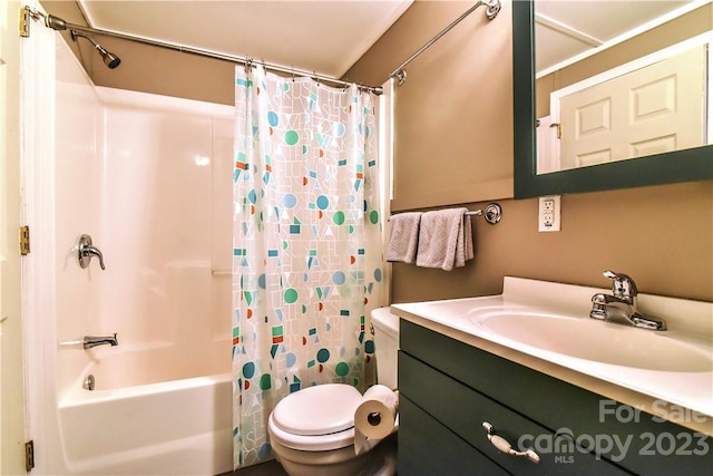 full bathroom featuring shower / tub combo, toilet, and vanity with extensive cabinet space