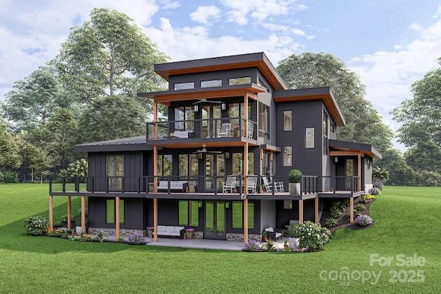 9999 Sourwood Rd, Canton, NC 28716 - rear view of house featuring a balcony, a yard, a patio area, and board and batten siding