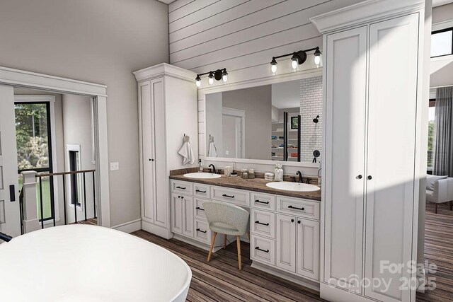 9999 Sourwood Rd, Canton, NC 28716 - full bath with wood finished floors, double vanity, and a freestanding tub