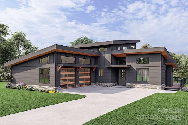 9999 Sourwood Rd, Canton, NC 28716 - modern home featuring board and batten siding, driveway, and a front yard