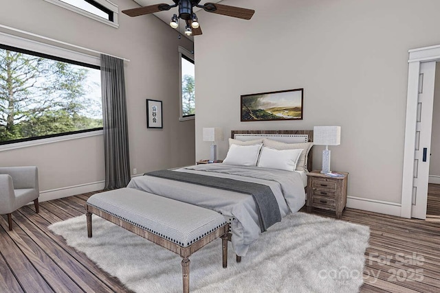 9999 Sourwood Rd, Canton, NC 28716 - bedroom featuring baseboards, wood finished floors, and a ceiling fan