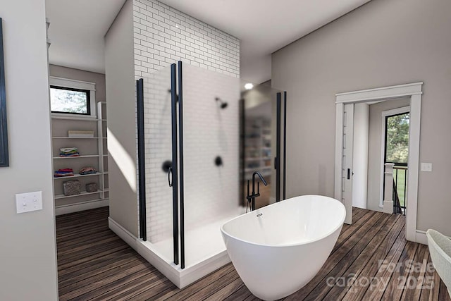 9999 Sourwood Rd, Canton, NC 28716 - bathroom featuring a soaking tub, wood finished floors, and a stall shower