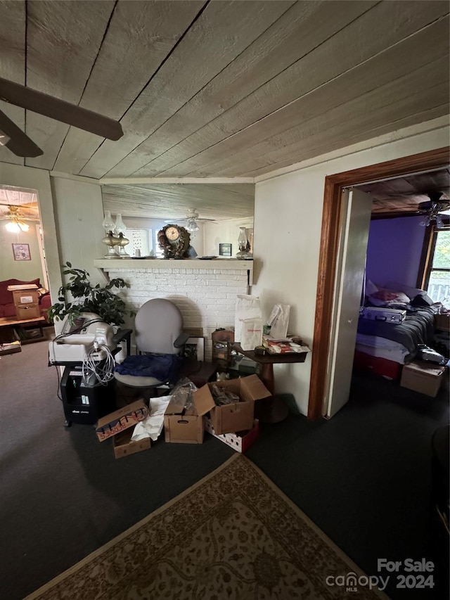 living room with wooden ceiling and carpet