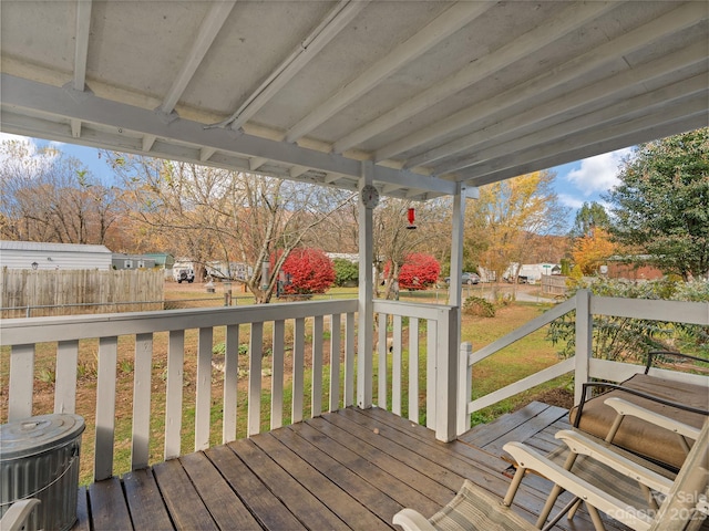 wooden terrace with a yard