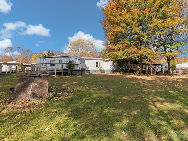 view of yard featuring a deck