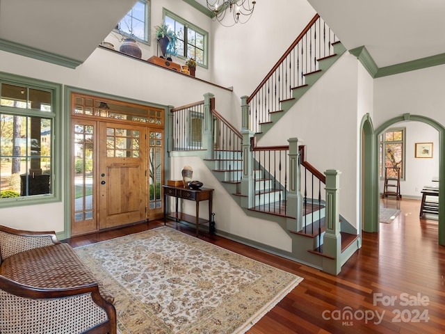 29 Elkton Dr, Pinehurst, NC 28374 - foyer featuring a wealth of natural light, ornamental molding, dark hardwood / wood-style flooring, and a towering ceiling