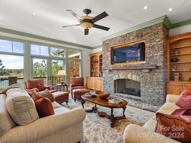 29 Elkton Dr, Pinehurst, NC 28374 - living room with built in features, ceiling fan, crown molding, and a stone fireplace