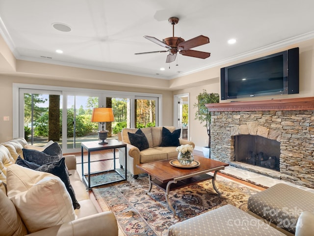29 Elkton Dr, Pinehurst, NC 28374 - living room featuring ornamental molding, hardwood / wood-style flooring, and a stone fireplace